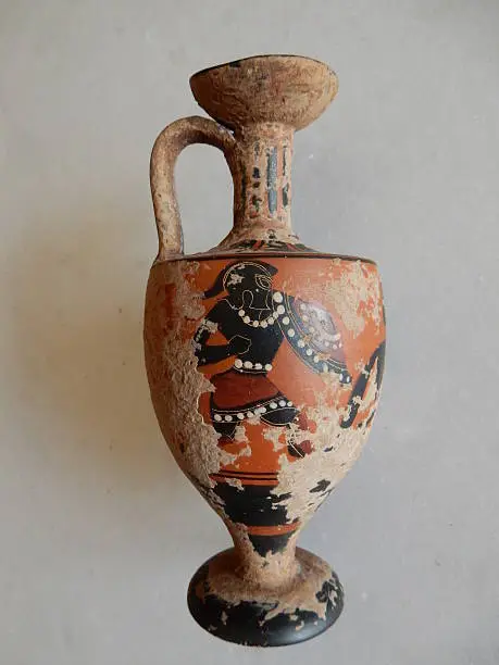 Amphora ancient painted pottery with black figures on a red background