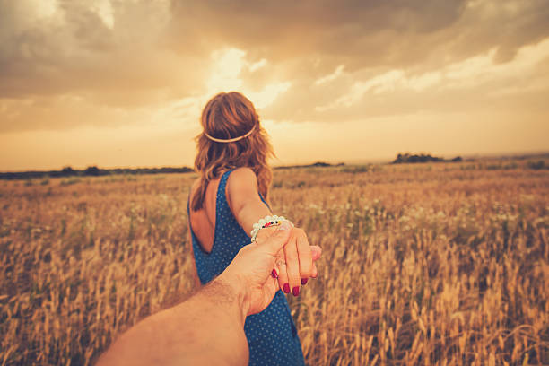 istock Girl taking her man to the wheat field. 627511652