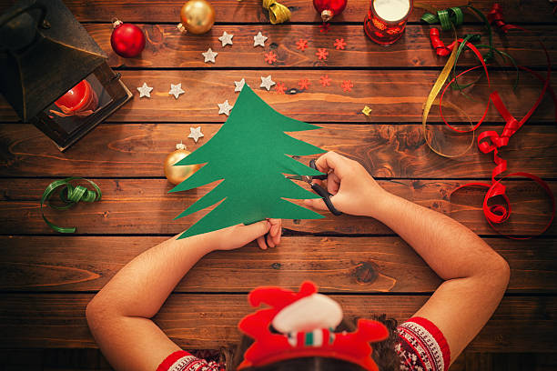istock Little Girl Making Christmas Card 627521986