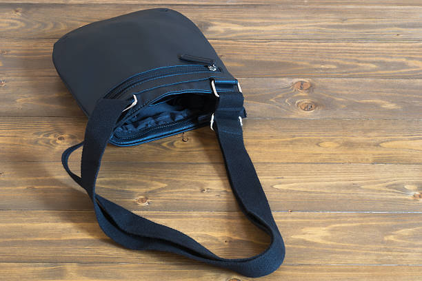 istock Open black bag on the floor 627522346