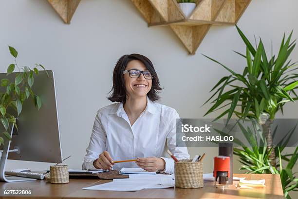 Cheerful Happy Woman Working At Office Stock Photo - Download Image Now - Adult, Adults Only, Beautiful People