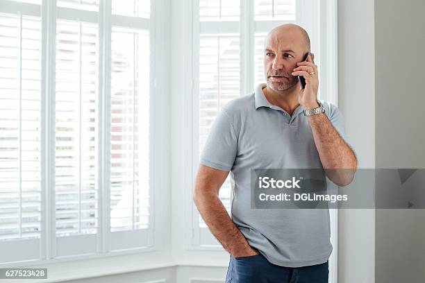 Talking On The Phone Stock Photo - Download Image Now - Using Phone, Serious, Talking