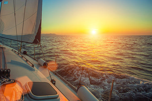 istock Ship yachts in the open Sea during amazing sunset. 627524928