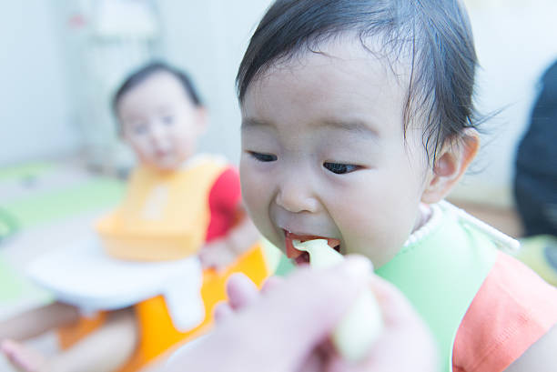 istock Cute baby with a meal 627540518