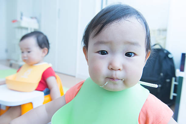 istock Cute baby with a meal 627540662