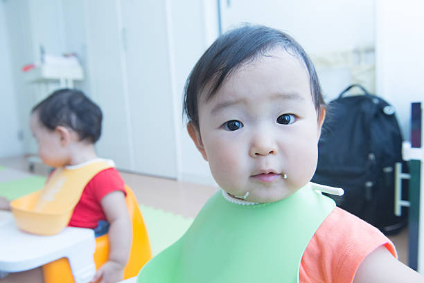 istock Cute baby with a meal 627540734