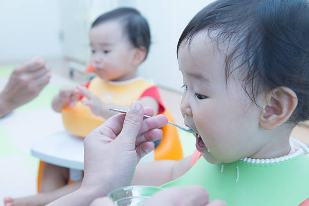 istock Cute baby with a meal 627540930