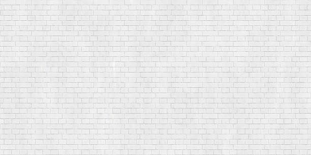 istock Background texture of white brick wall 627541328