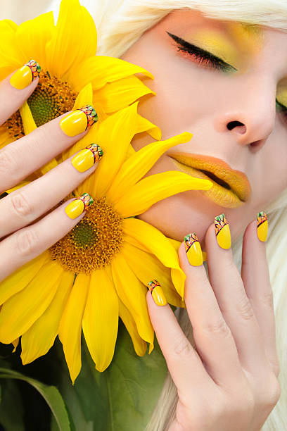 istock Yellow makeup and French manicure. 627542666