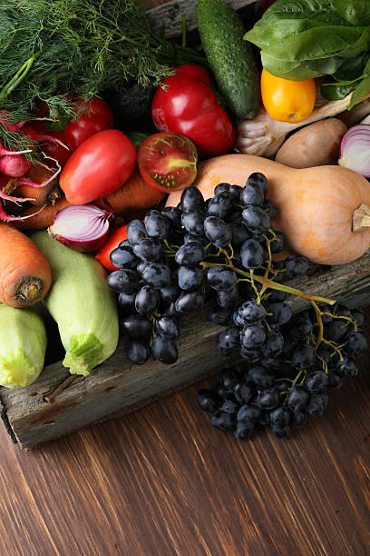 istock Fresh organic vegetables wood background 627557874