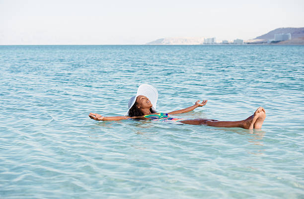 istock Woman perfect vacation on salty lake. 627558372