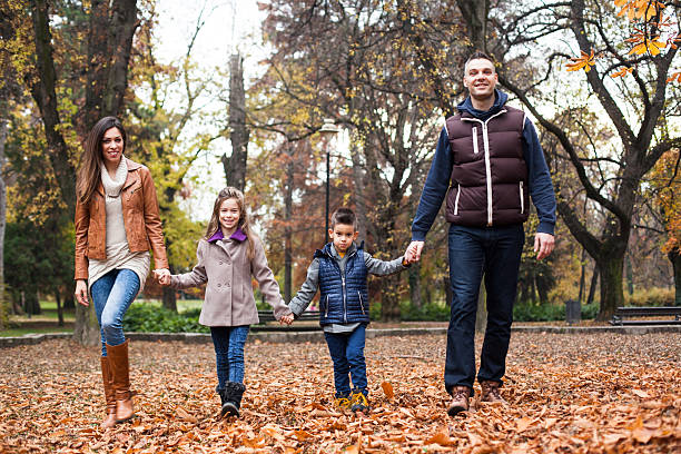 istock Family laughing at the park 627558738