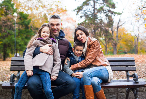 istock Family laughing at the park 627558948