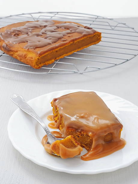 Pumpkin sticky pudding with toffee caramel sauce stock photo