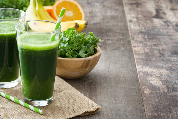 istock Smoothie with kale, banana and orange 627574430