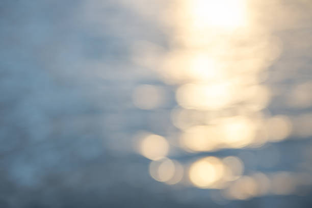 istock Water reflection blur golden bokeh background 627575818
