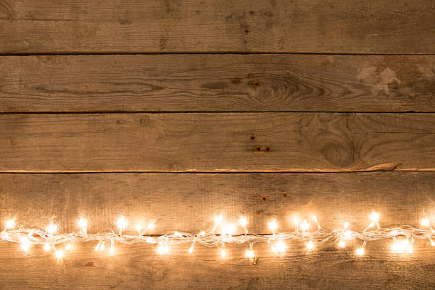 Christmas rustic background - vintage planked wood with lights stock photo