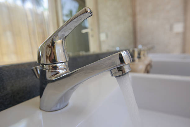 istock Water tap with flowing water 627582530