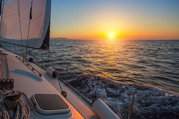 istock Sailing boat during amazing sunset on the sea. 627586814