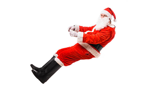 istock Santa Claus driving imaginary car 627587450