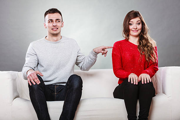 istock Shy woman and man sitting on sofa. First date. 627626988