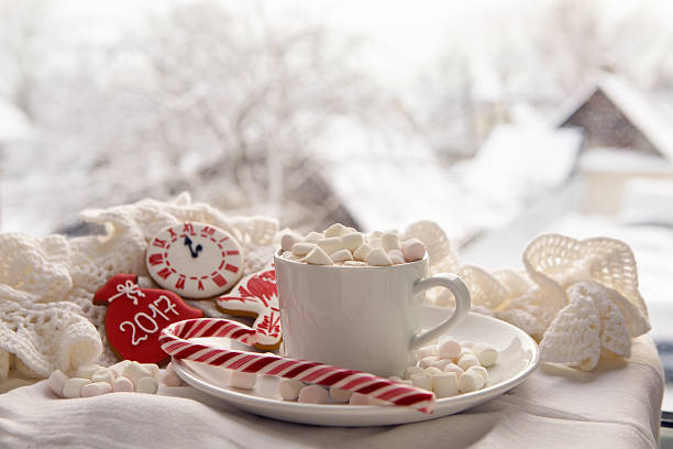 istock white Cup of cocoa on a saucer, marshmallows and candy 627628958
