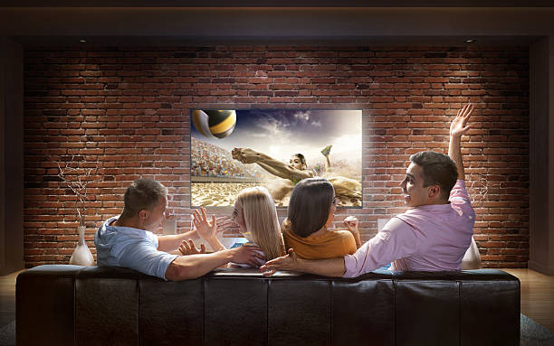 istock Couples watching Volleyball game at home 627645900