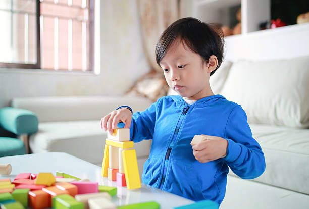 istock Cute asian Children playing with blocks 627646044