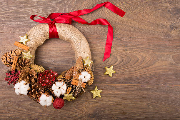 istock Christmas wreath and decor on a wooden background 627646342