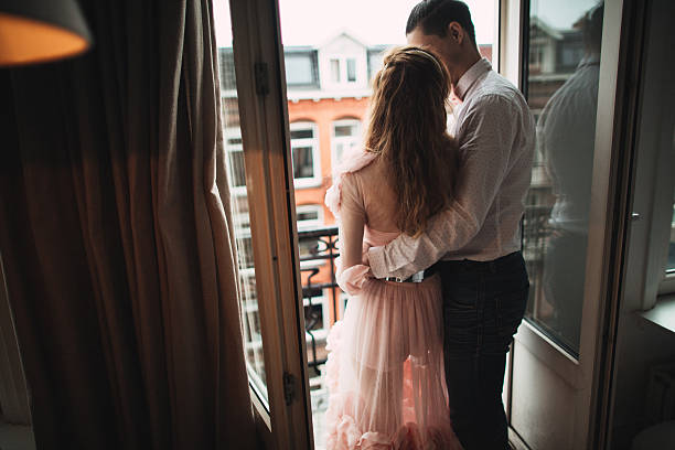 istock Kissing on the balcony 627646534
