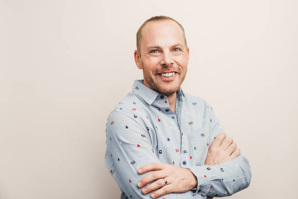 istock Handsome real man in christmas shirt smiling 627661884