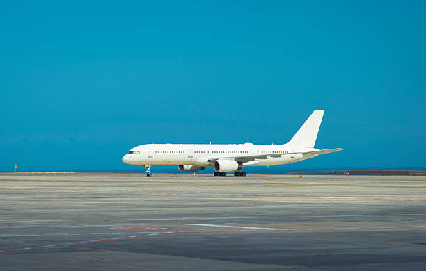 istock White passenger airplane on airport runway 627667610