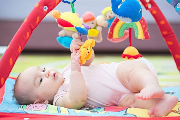istock Sweet Baby Crawling And Playing With Toys 627668174