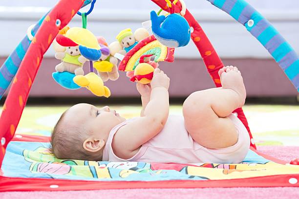istock Sweet Baby Crawling And Playing With Toys 627668254