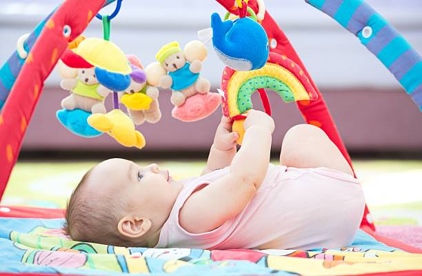 istock Sweet Baby Crawling And Playing With Toys 627668292