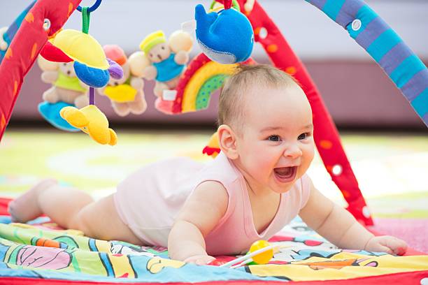 istock Sweet Baby Crawling And Playing With Toys 627668366