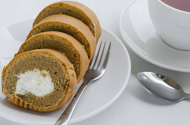 istock Coffee Cake Roll with Cup of Tea On Tea Time. 627668992