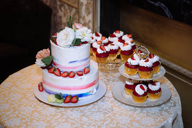 istock Sweet multilevel wedding cake decorated with beautiful flowers. Candy bar 627669216