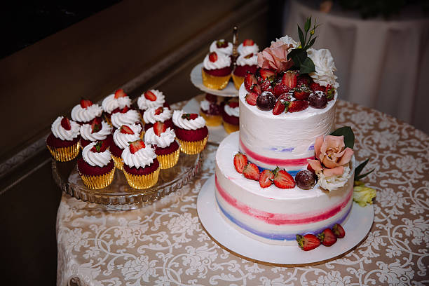 istock Sweet multilevel wedding cake decorated with beautiful flowers. Candy bar 627669254