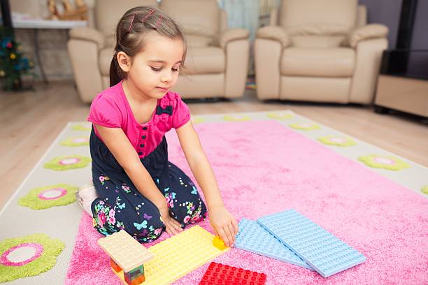 istock Little Girl Playing At Home 627669912