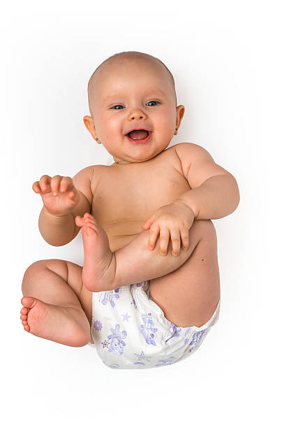 istock Adorable baby girl lying on back - isolated on white 627671816
