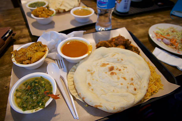 istock SINGAPORE - JULY 23rd, 2016: Indian dish curry lunch set 627672756