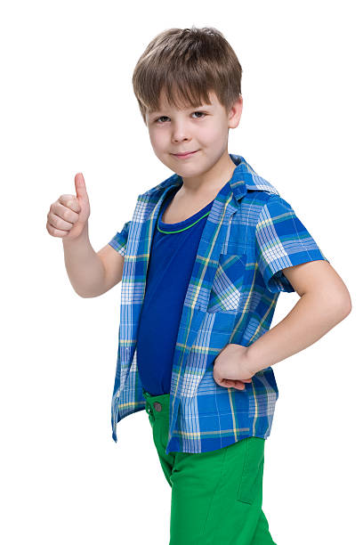istock Smiling little boy holds his thumb up 627672920