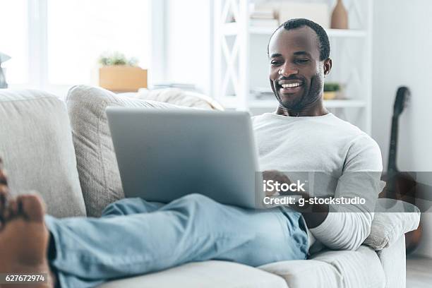 Relaxation At Home Stock Photo - Download Image Now - Laptop, Men, Domestic Life