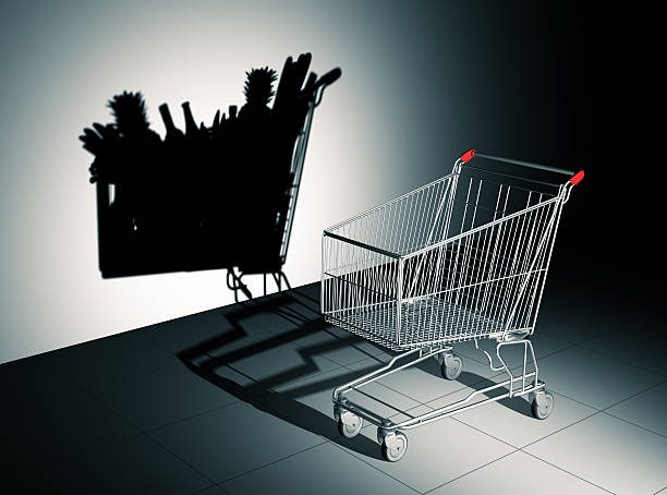 Empty Shopping Cart Cast Shadow On The Wall As Full Shopping Cart stock photo