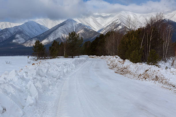 istock Snow-covered road in Trans-Baikal National Park. 627676632
