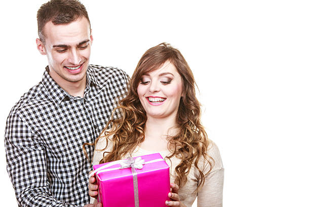 istock couple in love with pink gift box 627678402