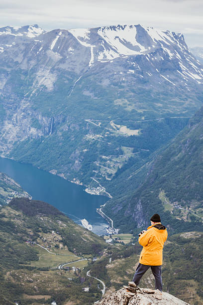 istock Tourist taking photo from Dalsnibba viewpoint Norway 627681822