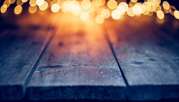 istock Christmas lights on empty table - Background Defocused Blue wood 627683252