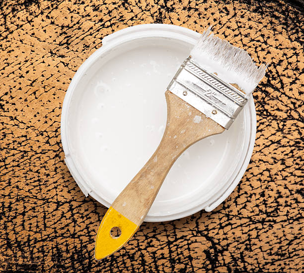 istock Can of white paint with brush 627712700